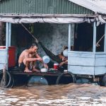 Local coming back on street again after flood descends